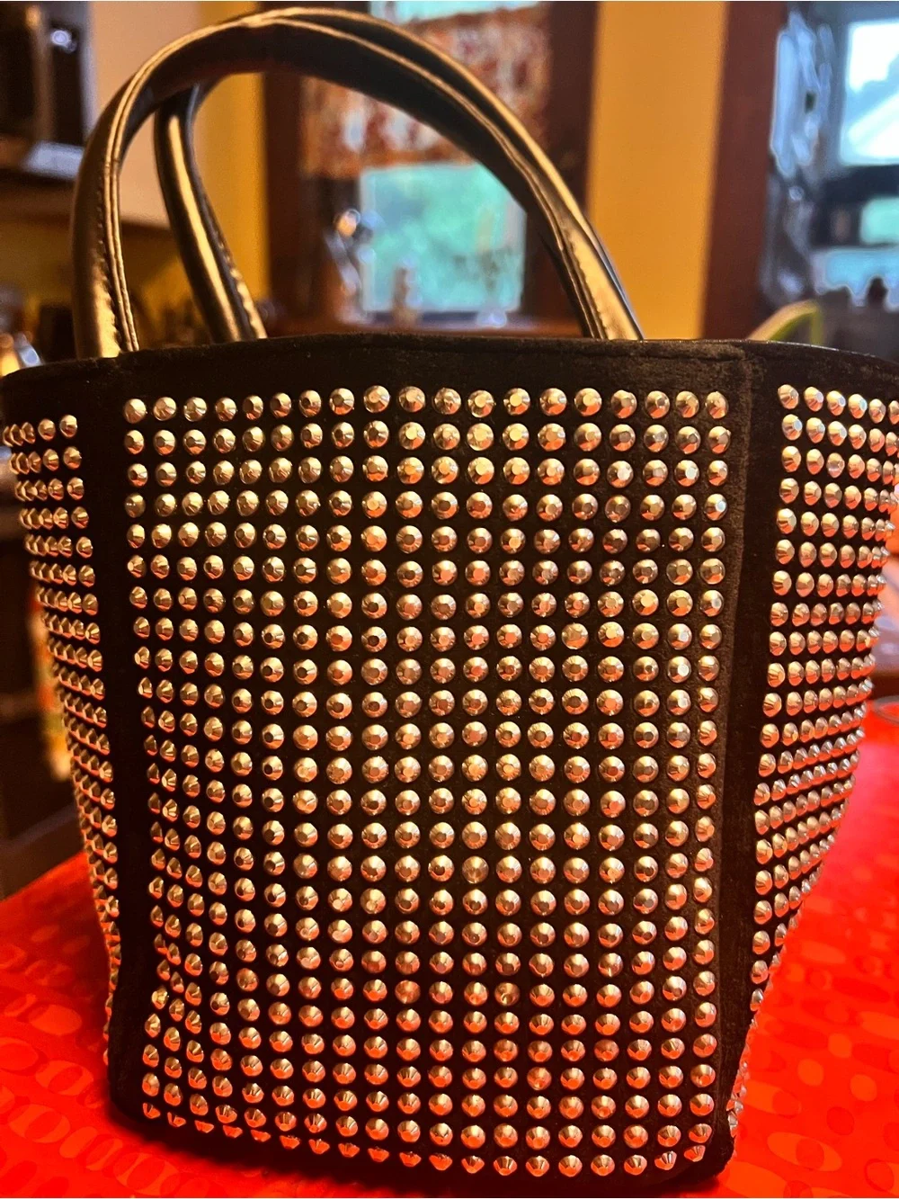 Fun and funky black and silver studded bucket bag. 80s and 90s studio 51 vibes!